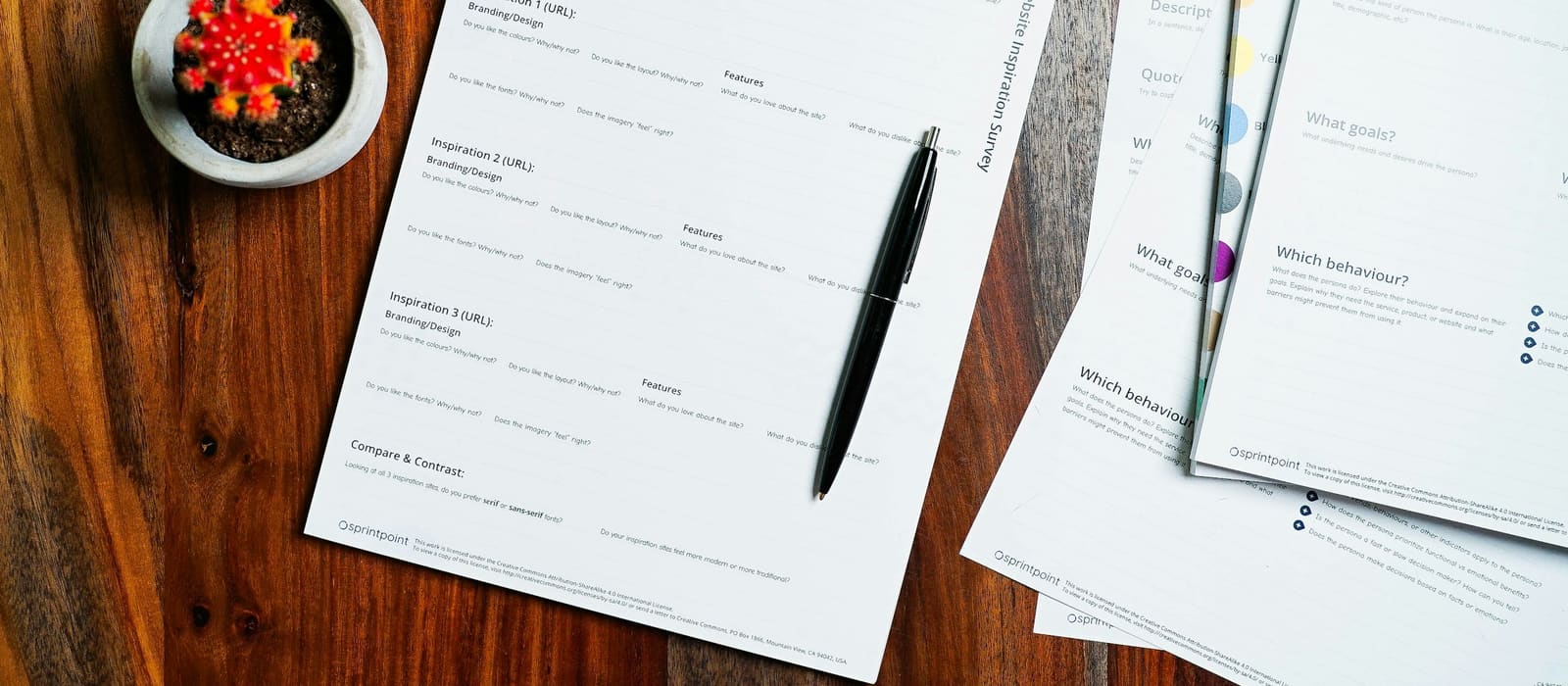 Licence and approval paperwork being reviewed and signed at a desk